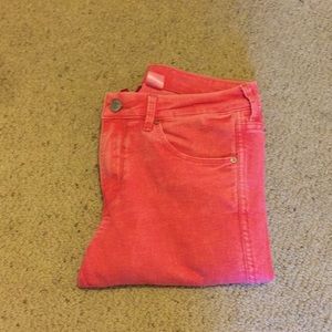 Pink jeans with ankle zips